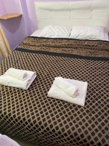 Кровать или кровати в номере palm club apart otel