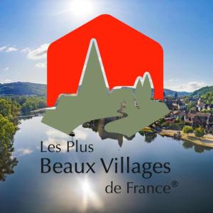 two birds flying over a lake with the words les plus beaux villages de fr at Le Petit Chat in Beaulieu-sur-Dordogne
