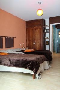 a bedroom with a large bed in a room at Maison de 3 chambres avec jardin clos et wifi a Mouzillon in Mouzillon