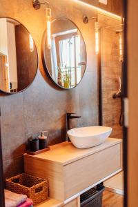 a bathroom with a sink and a mirror at Pieninski relaks in Jaworki +24 photos