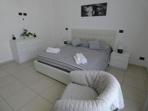 A bed or beds in a room at Casa Landolina Noto