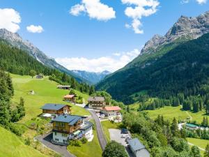 an aerial view of a village in the mountains at Hotel Tiroler Herz in Hinterhornbach