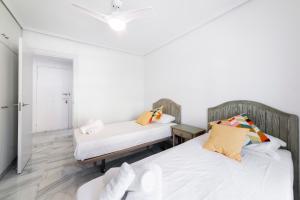 Postel nebo postele na pokoji v ubytování Apartamento Faro 2