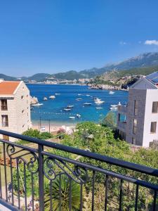 a view of a body of water with boats in it at Apartment Sara with seaview in Budva