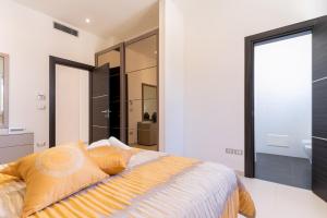 A bed or beds in a room at Villa Finibus Terrae