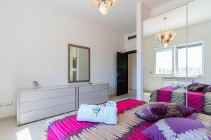 A bed or beds in a room at Villa Finibus Terrae