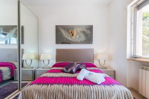 A bed or beds in a room at Villa Finibus Terrae