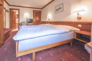 Postel nebo postele na pokoji v ubytování Antares Hotel
