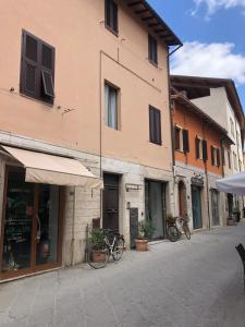 a building with two bikes parked in front of it at Zero45 San Martino Apartment in Grosseto +8 photos