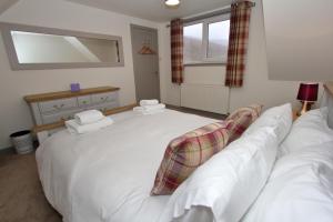 Ein Bett oder Betten in einem Zimmer der Unterkunft Katie's Cottage