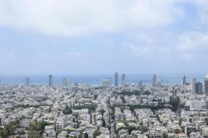 une vue aérienne sur une ville avec de grands bâtiments dans l'établissement Spacious 3BR Duplex w Balcony in City Center by Sea N' Rent, à Tel Aviv