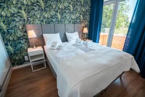 Posteľ alebo postele v izbe v ubytovaní Świerkowy 6 Dolina Szczęścia Apart Invest
