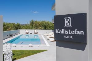 a sign for a hotel next to a swimming pool at Kallistefan in Kissamos