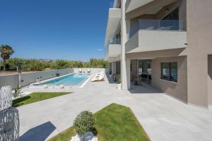 a view of the backyard of a house with a swimming pool at Kallistefan in Kissamos