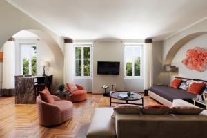 a living room with a couch and a table at LISTON'S Central Suites in Corfu Town