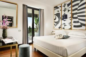 Postel nebo postele na pokoji v ubytování Hotel Pulitzer