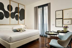 Postel nebo postele na pokoji v ubytování Hotel Pulitzer