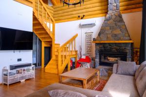 Televízia a/alebo spoločenská miestnosť v ubytovaní Holiday Home Wellspring