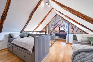 a bedroom with a bed and a couch at Florek & Florica Kalnik in Kalnik +97 photos