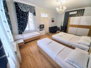 Postel nebo postele na pokoji v ubytování ApartHotel RioNi