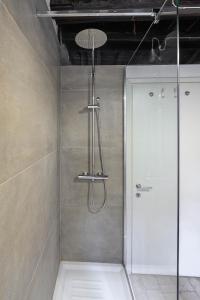 a shower with a glass door in a bathroom at Casa Nora in Rome +20 photos