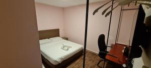 Postel nebo postele na pokoji v ubytování Misto Hotel