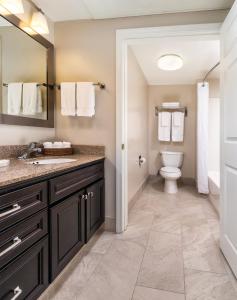 a bathroom with a sink and a toilet at WorldMark San Diego - Balboa Park in San Diego