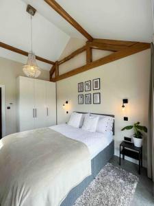 Säng eller sängar i ett rum på Lodge Barn Annexe