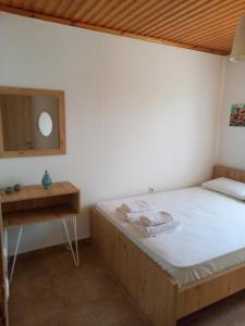 Łóżko lub łóżka w pokoju w obiekcie Villa Niki