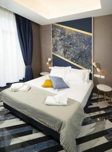 a bedroom with a large bed in a room at Hotel Cala Moresca in Bacoli