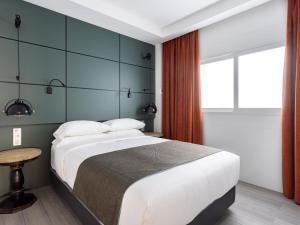 Postel nebo postele na pokoji v ubytování PillowAbroad - Médano B