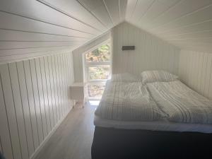 Ένα ή περισσότερα κρεβάτια σε δωμάτιο στο Aurora woods