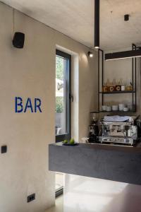 a kitchen with a bar sign on the wall at Moro Inn in Korčula
