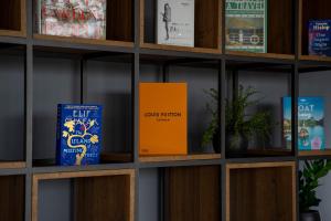 a book shelf with books on it at Moro Inn in Korčula