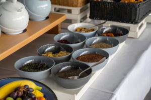 a bunch of bowls of food on a table at Moro Inn in Korčula