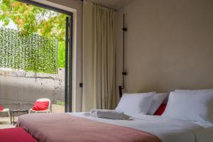 a bedroom with a bed and a large window at Moro Inn in Korčula