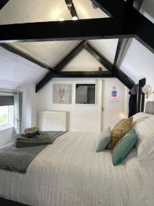 a bedroom with a large bed in a room at Britannia inn in Sherborne