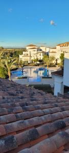 a view of a pool from the roof of a building at La Torre Golf Resort, Mero, Torre-Pacheco, Murcia in Murcia