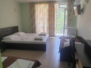 Postel nebo postele na pokoji v ubytování Hotel Maria