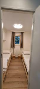 a room with two beds and a window at Vakantiepark Bonte Vlucht in Doorn +44 photos