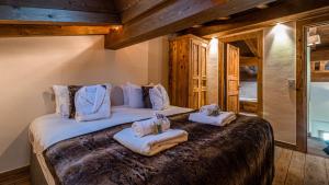 Posteľ alebo postele v izbe v ubytovaní Chalet Entre Nous