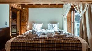 Posteľ alebo postele v izbe v ubytovaní Chalet Entre Nous