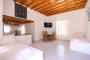 Voodi või voodid majutusasutuse Mykonos in White toas +25 fotot