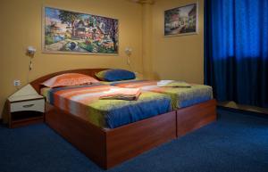 Postel nebo postele na pokoji v ubytování Kalypso Hotel