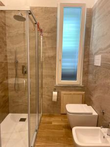 a bathroom with a shower and a toilet and a sink at Alemar Bed & Breakfast in Mondello +31 photos