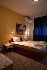 Postel nebo postele na pokoji v ubytování Kalypso Hotel