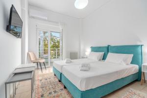Katil atau katil-katil dalam bilik di COSTA VASIA Seaside Suites and Apartments