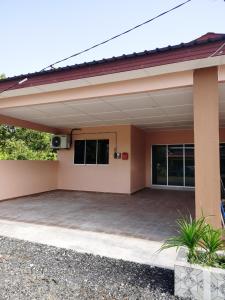 a rendering of a house with a patio at Homestay Che Naa in Kuantan