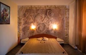Postel nebo postele na pokoji v ubytování Kalypso Hotel