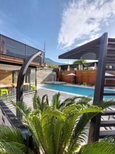 a resort with a swimming pool and a building at Residence Lake Como in Colico